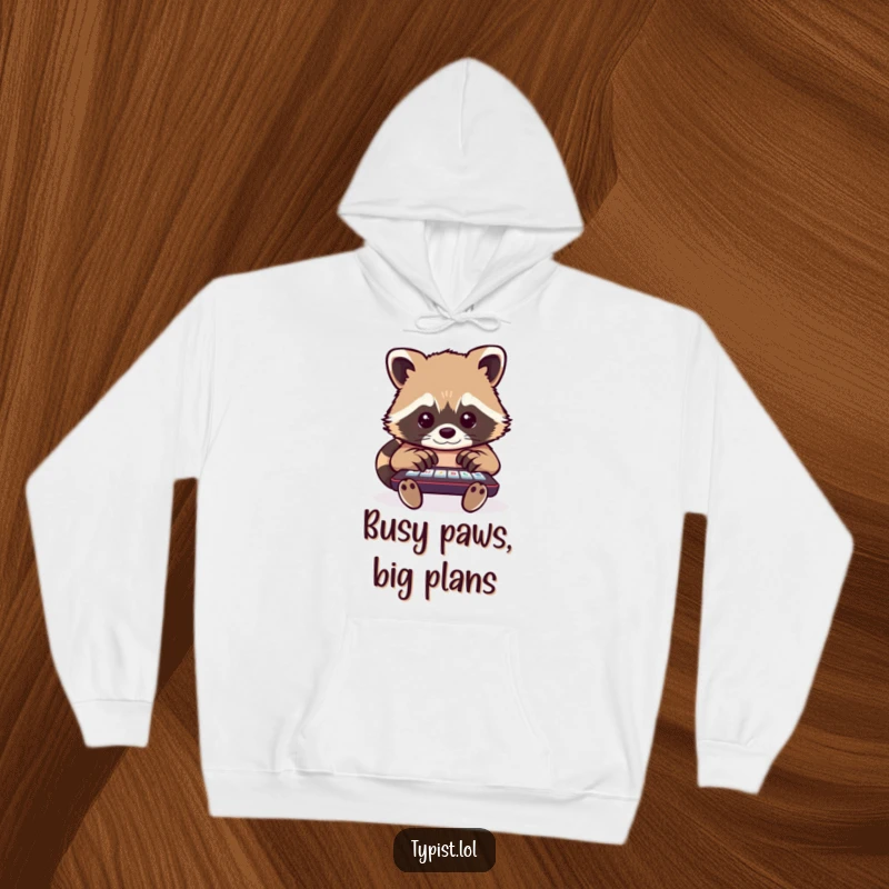 Funny raccoon hoodie showing a determined raccoon typing with many paws, ideal for staying warm while celebrating multitasking.