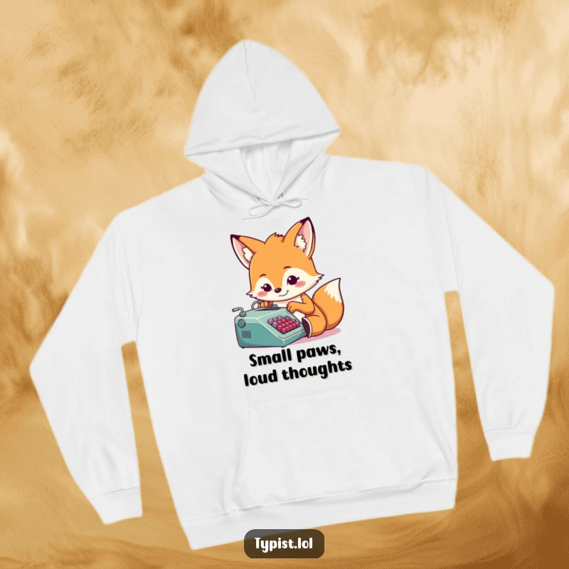 Funny, determined fox typing on a tiny typewriter, cozy hoodie for writers, humorous and warm, great gift idea.