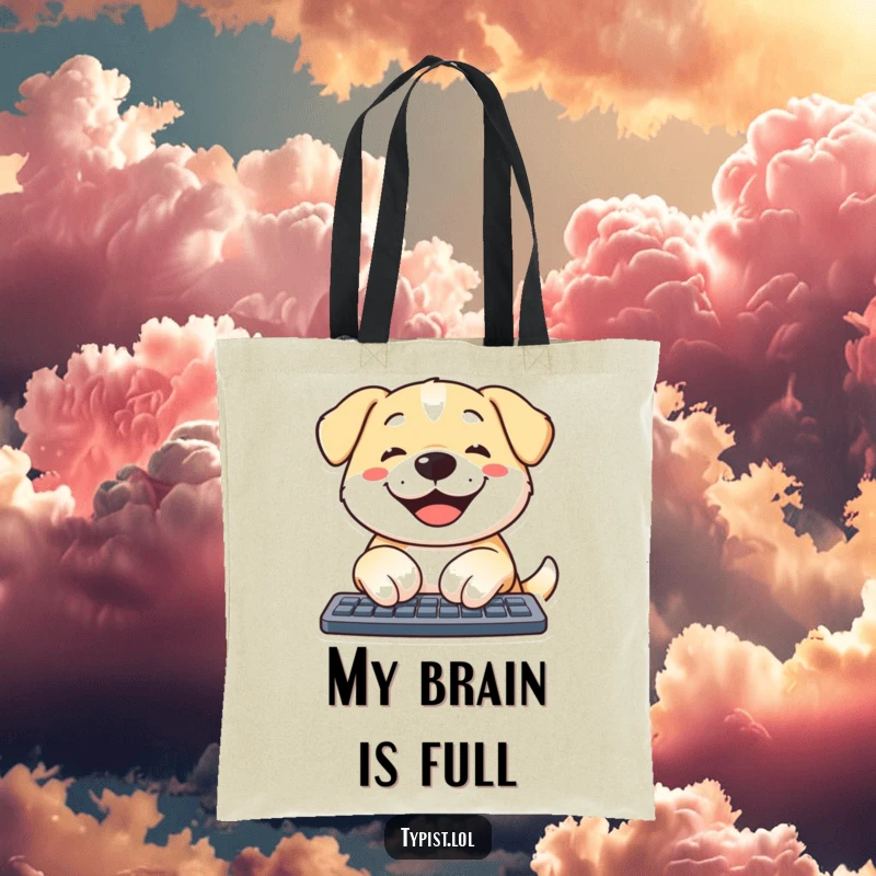 Funny dog tote bag featuring a smiling dog happily typing on a computer, ideal for carrying books or groceries with humor.